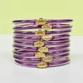 Close-up of 9-layer purple glitter silicone bracelets with gold lotus buckles - Purple
