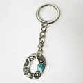 Vintage silver stainless steel keychain with letter O and turquoise stone detail - Letter O