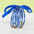 5-piece set of blue glitter silicone jelly bangles with a decorative blue satin ribbon bow - 5 Pieces / Blue