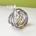 Set of 9 glitter jelly bangles featuring gold wrap detail and a gray silk ribbon bow - 9 Pieces Set / Dark Gray