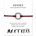 Detail view of red gymnastics cord bracelet with inspirational sport quote card - Red