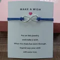 Blue cord infinity symbol bracelet with a printed 'Make a Wish' greeting card. - Infinity Symbol (EB0168) / Blue