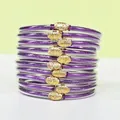 Set di 10 braccialetti jelly con glitter viola e ciondoli a forma di loto dorato eleganti - Confezione da 10 / Viola chiaro