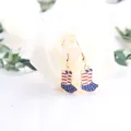 Close-up of patriotic American flag boot earrings with red white and blue enamel detail - Boots Style