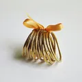 Set van 12 gouden glitter jelly bangles van flexibele PVC siliconen met goud lint - Goud
