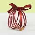 Set of 5 red glitter silicone bangles with matching ribbon bow and gold charms - 5 Pieces / Red