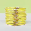Bracciali jelly gialli con glitter in PVC e chiusura a loto dorata, set da 10 pezzi. - Confezione da 10 / Giallo