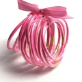 Set van 10 levendige roze glitter siliconen jelly bangles met een bijpassende strik - Dieproze