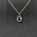 Vintage silver-toned initial O necklace with turquoise stone and embossed patterns. - Letter O