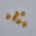 Detailed view of 16mm round glass ball charms with gold foil filling for jewelry making - Gold Yellow