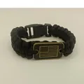 Detailed view of black paracord survival bracelet with antique US flag metal plate - Black