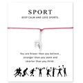 Gros plan d'un bracelet de gymnaste en argent sur un cordon rose avec carte de sport. - Anneaux de Gymnastique Rose