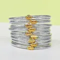Lot de 9 bracelets en silicone pailleté argent avec breloques de lotus dorées élégant - Pack de 9 Pièces / Argent