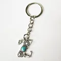 Vintage silver keychain featuring an engraved letter Z pendant with turquoise stone inlay - Letter Z