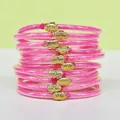 Set di 10 bracciali jelly rosa glitterati con ciondoli a loto dorati in PVC morbido - Confezione da 10 / Rosso rosa