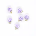 Macro view of 16mm round transparent pendants with purple foam balls for DIY jewelry - Purple