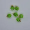 Detail view of 16mm transparent glass balls filled with green faceted beads for jewelry. - Army Green