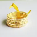 6-layer set of gold glitter filled silicone bangles with a decorative yellow ribbon - Yellow