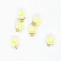 Detail view of 16mm transparent charms filled with yellow foam balls for DIY jewelry - Yellow