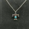 Vintage silver-tone letter T necklace featuring a turquoise stone and engraved designs - Letter T