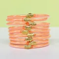Ensemble de 9 bracelets en silicone orange pailleté avec boucles de lotus dorées élégantes - Pack de 9 Pièces / Orange