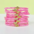 Lot de neuf bracelets en silicone à paillettes roses avec des breloques lotus dorées - Pack de 9 Pièces / Rose rouge