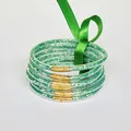 Elegant set of 6 green glitter PVC silicone bangles featuring a decorative satin ribbon tie - Green