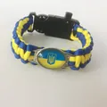 Paracord survival bracelet with Ukraine flag colors and emblem on white background - 5-in-1 Buckle Style / Blue-Yellow