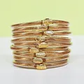 Ensemble de 9 bracelets en silicone à paillettes dorées avec breloques lotus élégantes - Pack de 9 Pièces / Or Antique