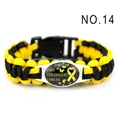 Dettaglio del braccialetto in paracord giallo e nero con l'icona Cure Childhood Cancer ribbon. - Nastro Consapevolezza Giallo