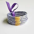 Set of 6 purple glitter silicone bangles with a decorative purple ribbon bow tie. - Dark Violet