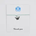 Mint green wax cord bracelet with a winged angel tooth charm on a Thank You card - Grass Green