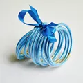 Set van 10 blauwe glitter jelly armbanden met een blauw lintje - Helder blauw