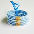 Set of six light blue glitter silicone jelly bangles featuring a blue ribbon tie - Sky Blue