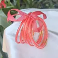 Set of 9 pink glitter jelly bangles made of flexible PVC silicone with gold accents. - 9 Pieces Set / Watermelon red