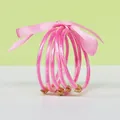 Five-piece set of glitter pink silicone bangles with lotus buckles and a pink ribbon bow - 5 Pieces / Pink