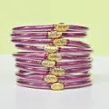 Lot de 9 bracelets en silicone violet pailleté avec breloques lotus dorées - Pack de 9 Pièces / Magenta