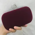 Close-up detail of a luxurious burgundy velvet evening clutch bag with rhinestone ring clasp - S / Burgundy