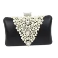 Macro view of detailed handmade V-shaped pearl and rhinestone evening clutch bag - Black