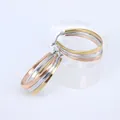 Detailed view of three-tone stainless steel oval hoop earrings with shiny metallic finish - Three Colors