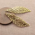Lot de deux grands pendentifs feuilles évidées pour la création de bijoux DIY dorés - Or antique