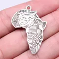 Vintage antique silver African map pendant featuring detailed Eye of Horus engraving - Africa Map Eye of Horus (B16320) / Antique Silver
