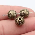 Vintage style 10mm bronze spacer beads with swirl texture for unique jewelry DIY designs - Antique Bronze