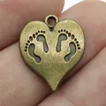 Vintage heart-shaped bronze pendant charm with engraved baby footprints for DIY jewelry - 10 Pieces Pack / Antique Bronze