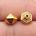 Set aus zwei antikgoldenen geometrischen sechseckigen Perlen für die Schmuckherstellung - 10er Pack / Altgold