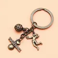 Vintage bronze volleyball themed keychain featuring a player and heart charm - Antique Copper (XY30006)