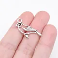 Piccolo ciondolo a forma di uccello in argento per gioielli fai da te, 27x11 mm - Argento antico