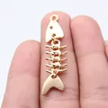 Gold-plated fishbone pendant charm in vintage zinc alloy, size 46x11mm for jewelry making - KC Gold
