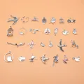 Set of 27 antique silver bird charms including swallows, hummingbirds, and pigeons. - Bird Theme Accessory (L10233) / 27 Pieces/Pack / Antique Silver