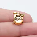 Small golden drum kit charm for DIY jewelry making with artistic musical note engraving - Drum Set Pendant (D10891) / Antique Gold